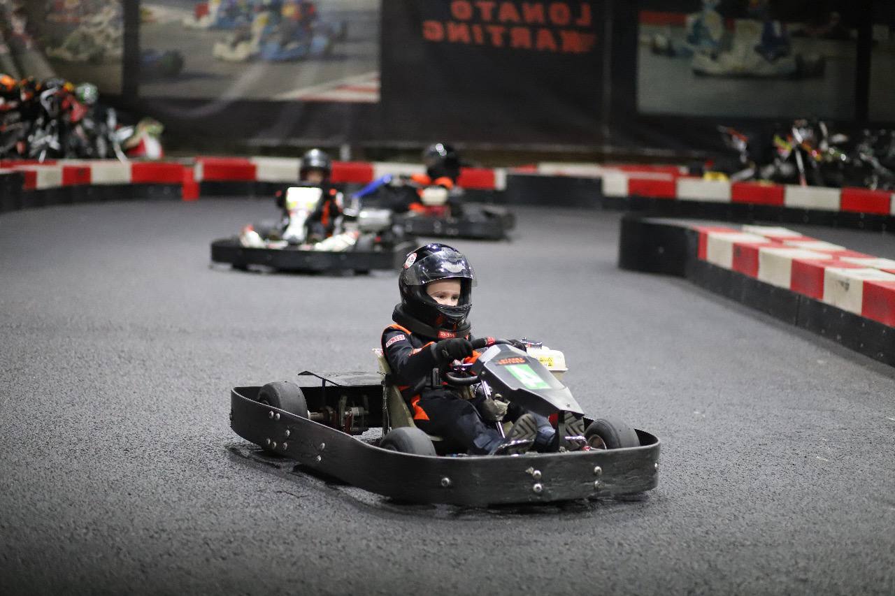 Kseniia in a go kart as a child